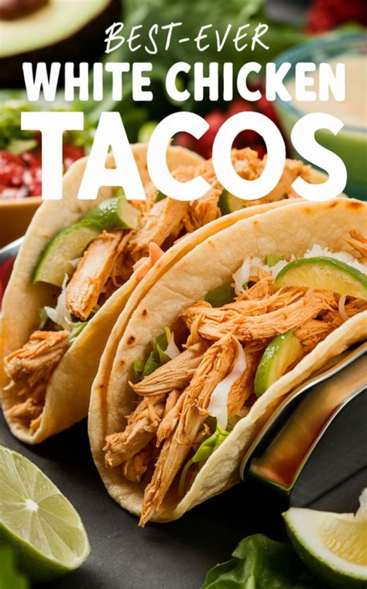 Chicken tacos on a white plate.
