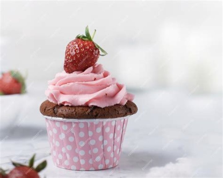 Close up of Strawberry Cupcake topped with strawberry buttercream