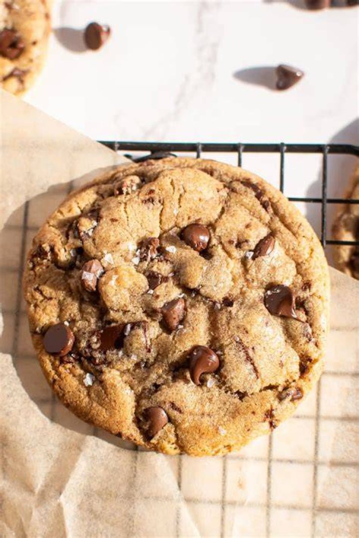Closeup of chocolate chip cookie dough ice cream in a metal loaf pan.