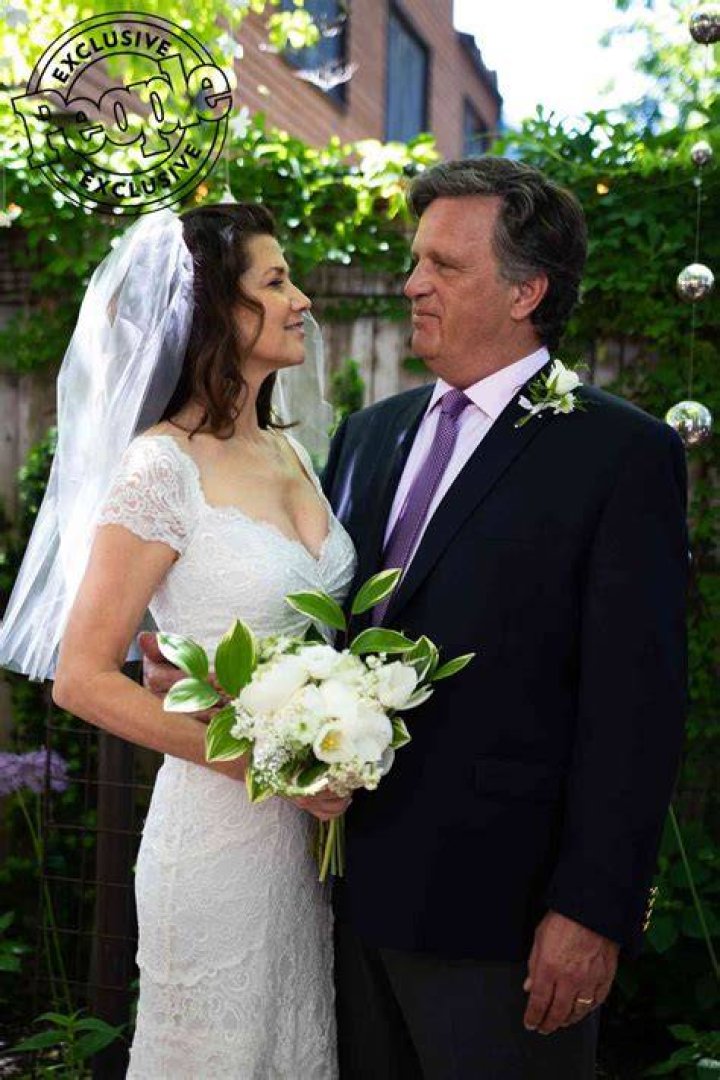 Daphne Zuniga in her wedding gown with husband David Mleczko.
