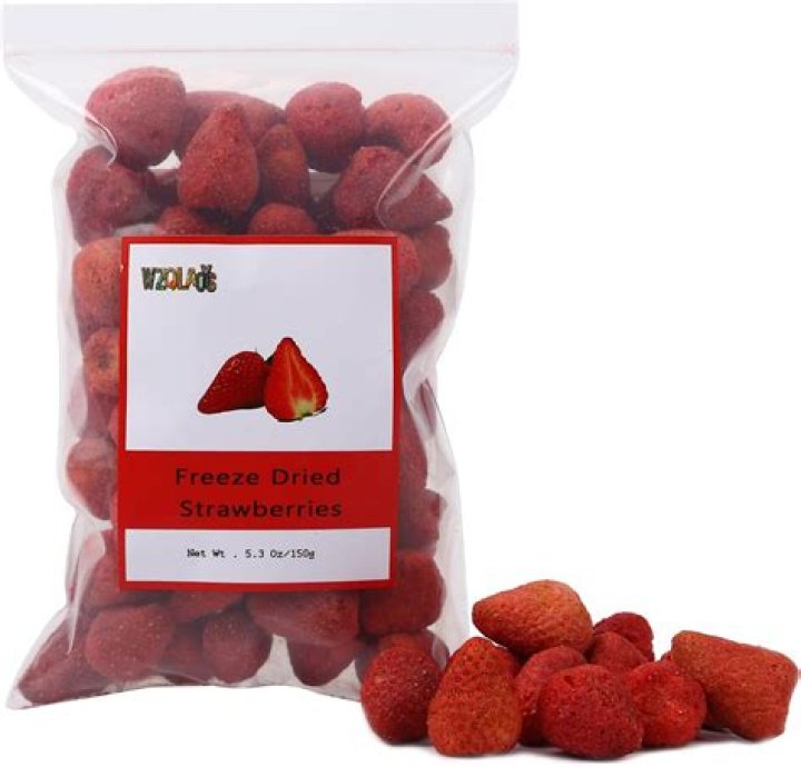 Freeze dried strawberries in a white bowl.