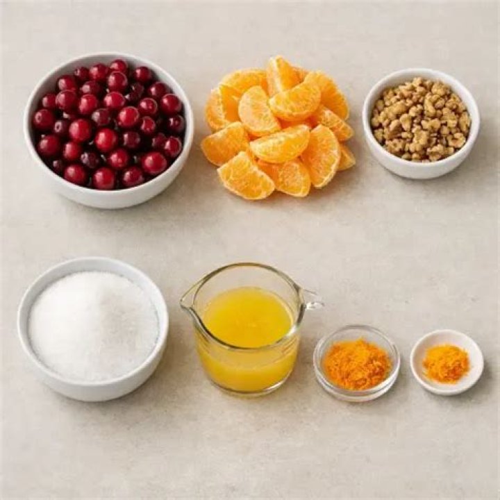 Ingredients for cranberry orange relish: cranberries, orange, apple, sugar.