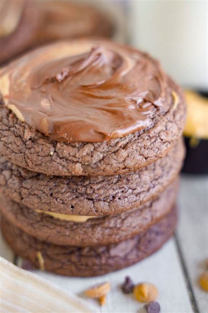Peanut butter brownie cookies stacked on top of each other.