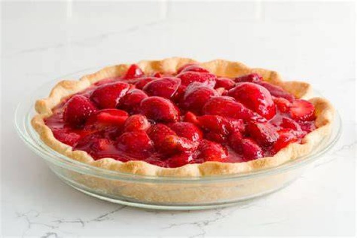 Strawberry pie in a glass pie plate.