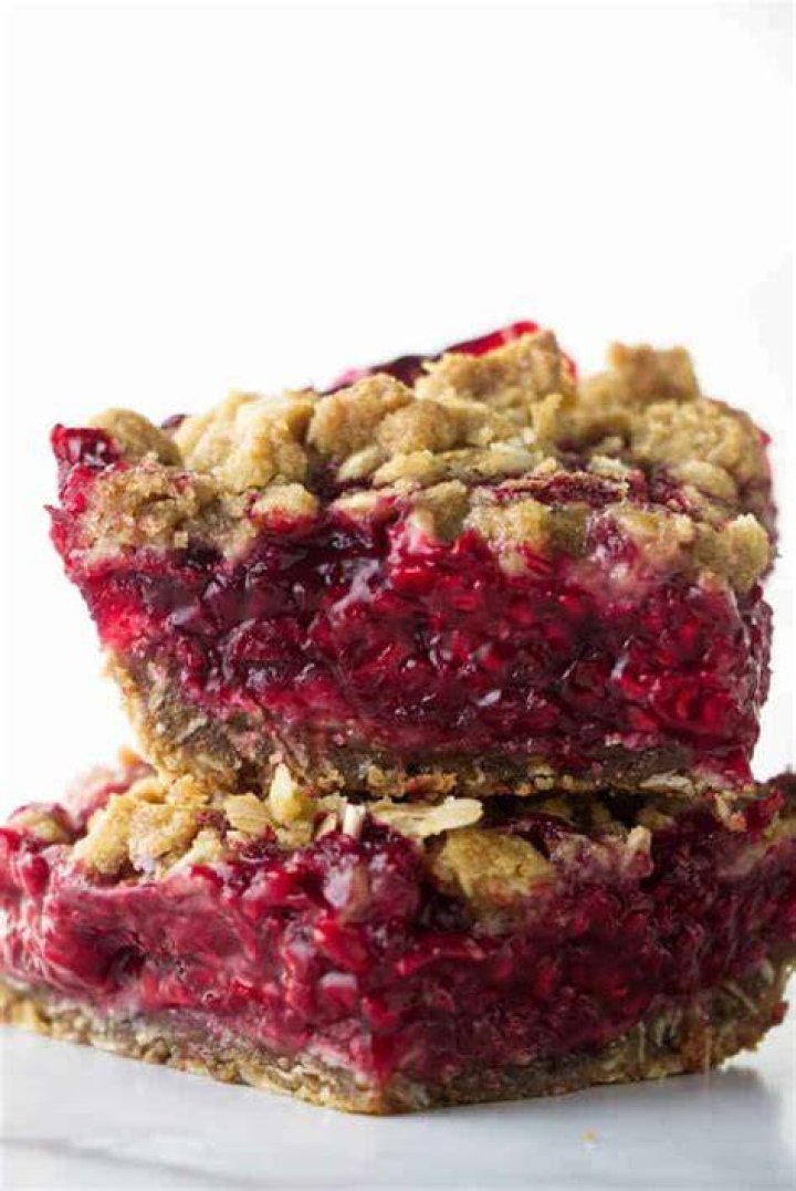Two raspberry bars stacked on top of each other.